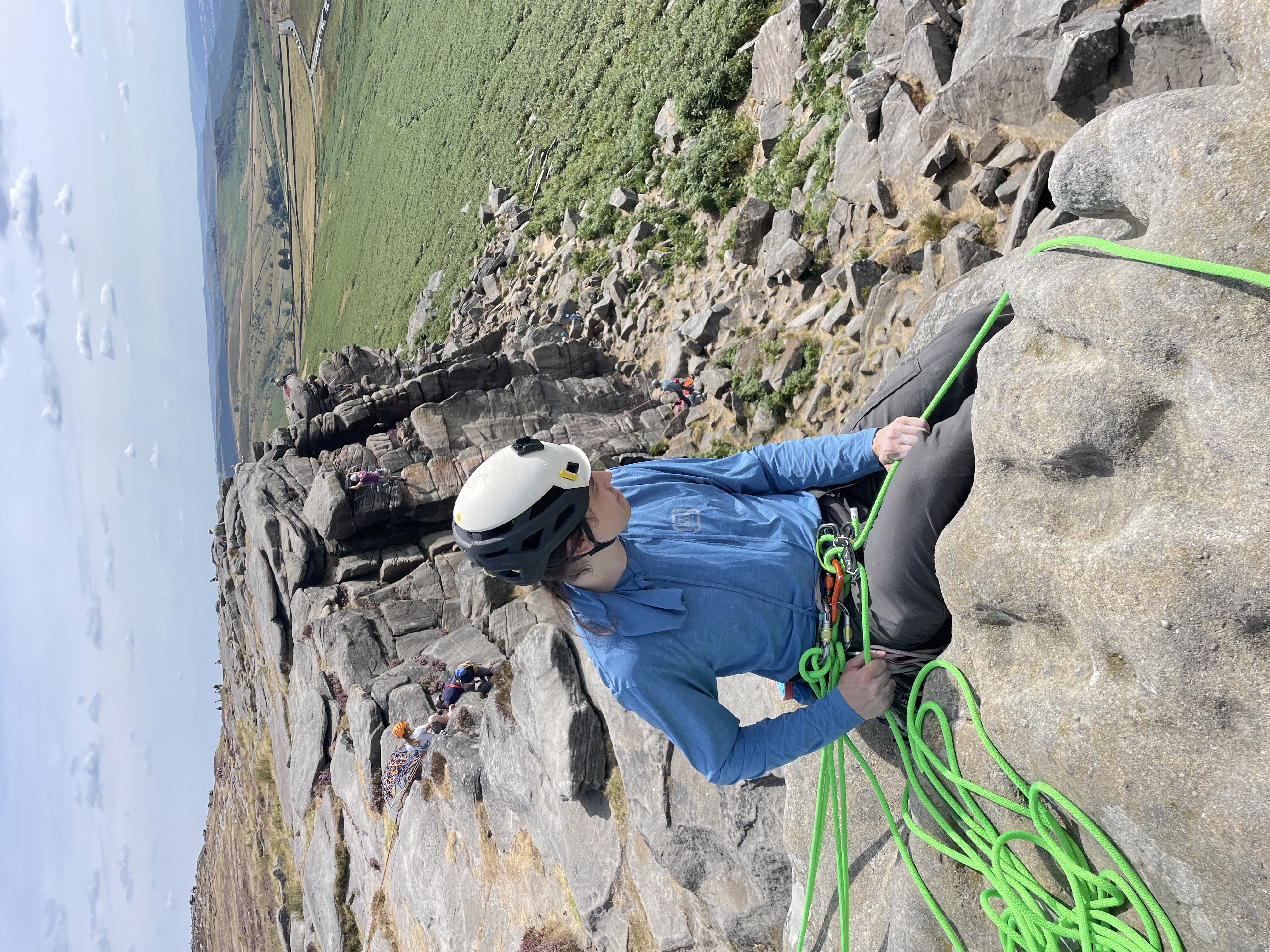Me, sitting by the cliff edge, giving a staged indirect belay